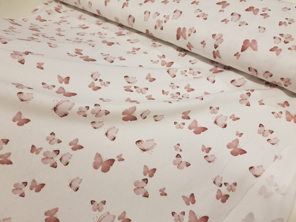 Bombažni jersey- puder roza metuljčki na off white osnovi